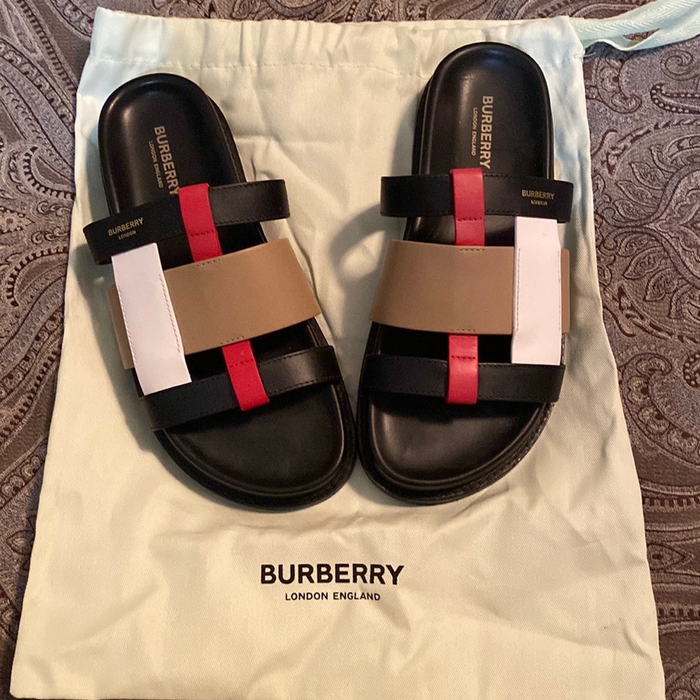The best Burberry slides! 💯 Authentic. Comes with dust cover.